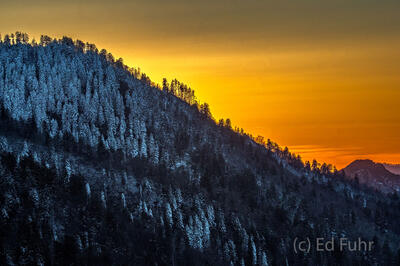 Sunset Above a Snowy Ridge