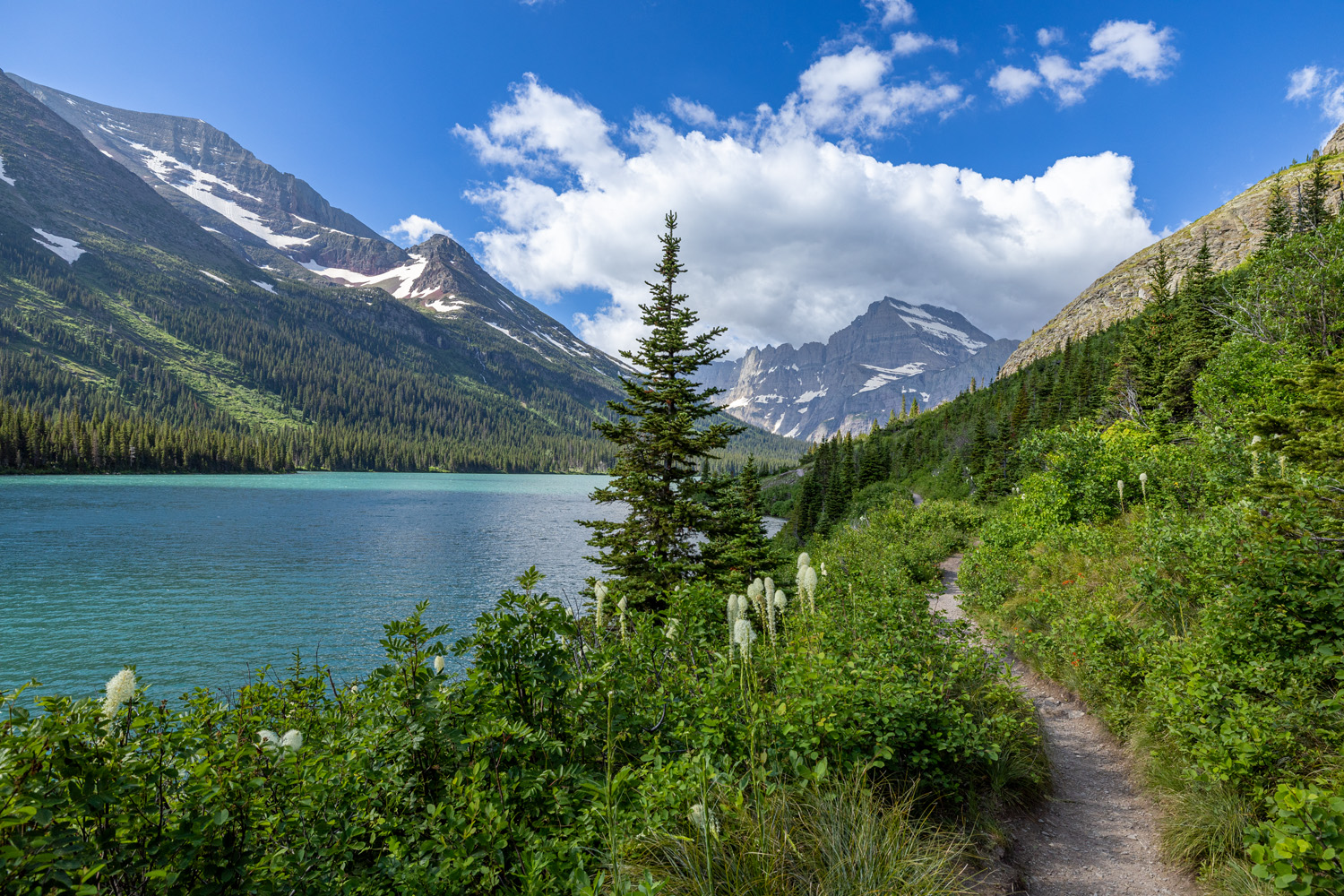 Grinnell Glacier trail passes along the north shores of Josephine Lake, an area frequently closed due to bear activity.