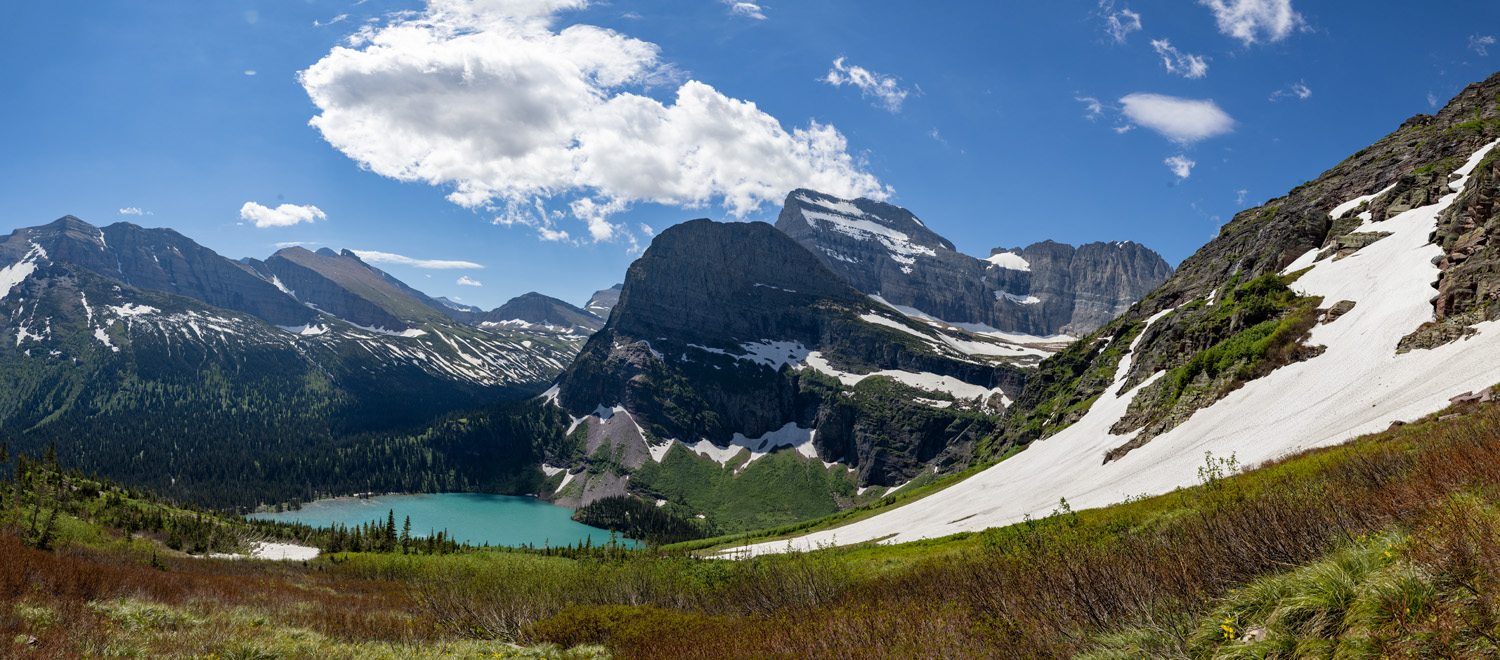 Mid-summer snow drifts block the trail to Grinnell Glacier but afford a scenic place to lunch above Grinnell Lake.