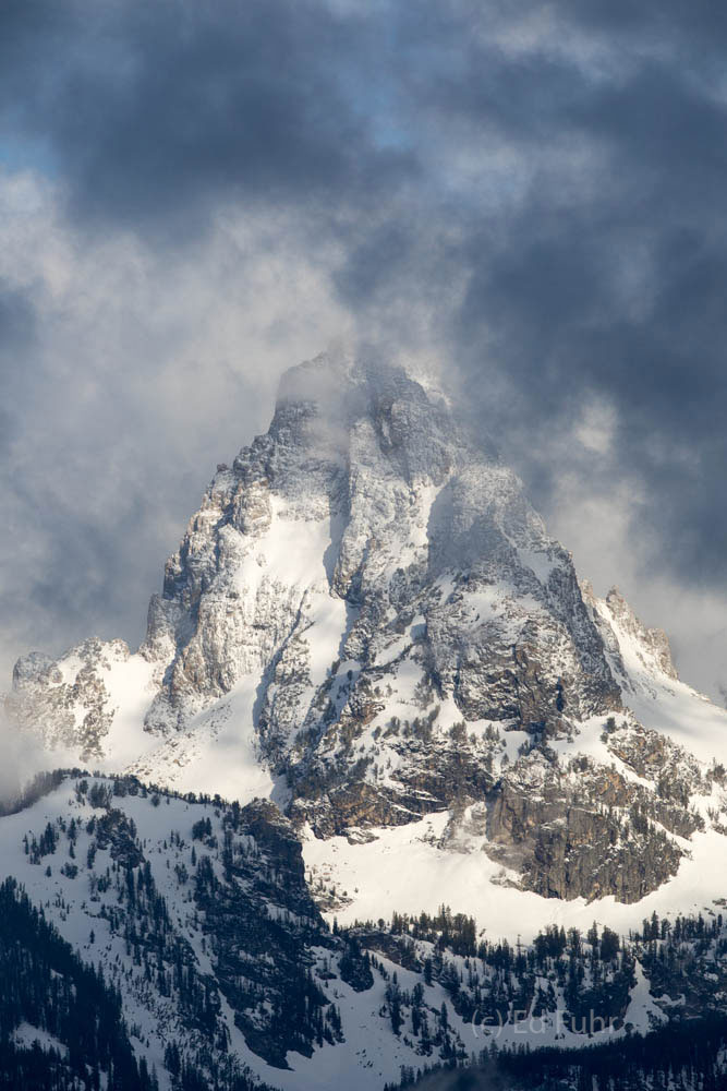 The Grand Teton emerges through the clouds of a June storm.
