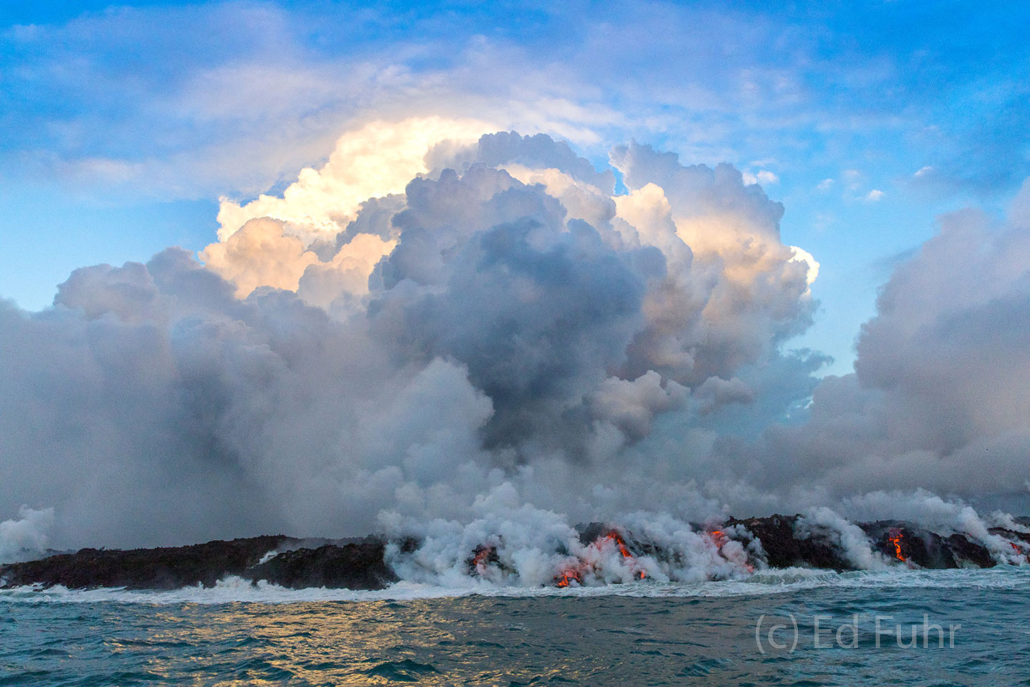 Pulling away from the lava flow as the sun rises, we see the steamy spectacle catches dawn's first ray