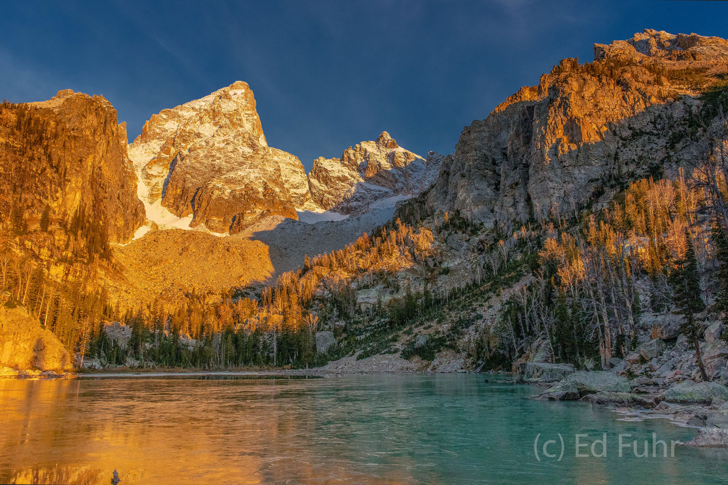 The turquoise waters of this alpine lake lay only partly hidden below a thin layer of ice.