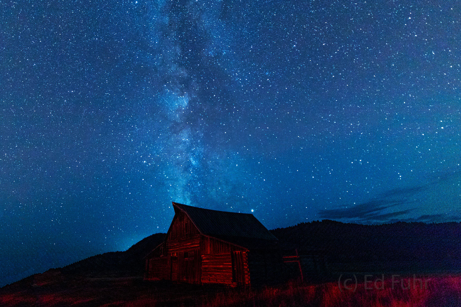 The milky way rises above the Moulton Barn, built more than a century ago, by settling Mormons.