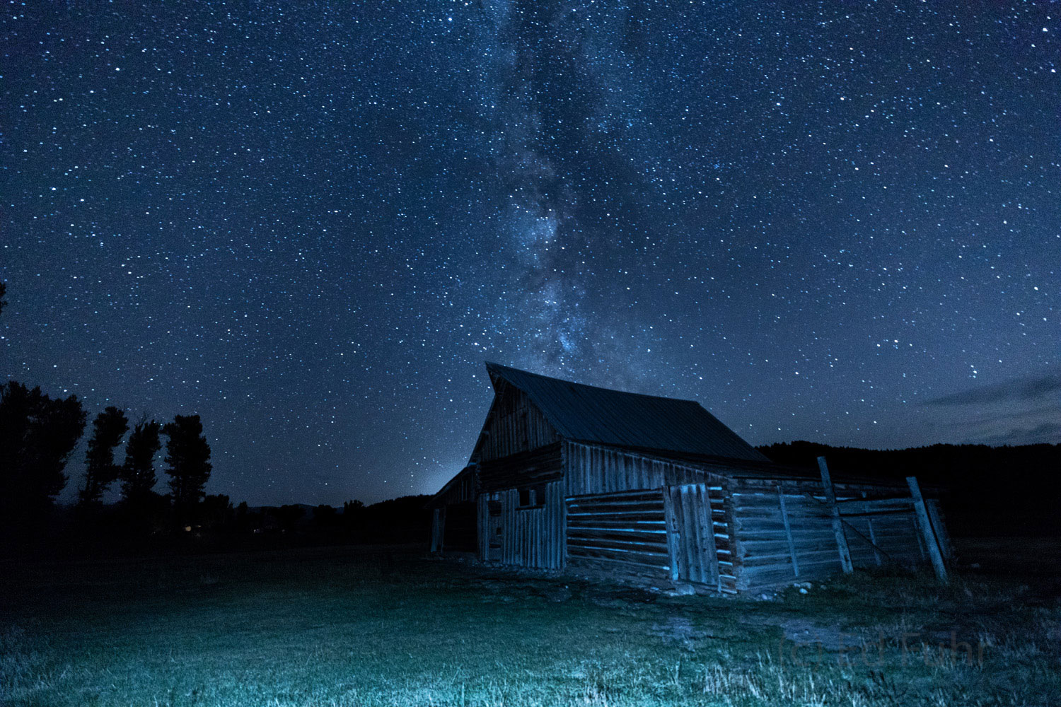 A starry night above the Moulton Barn.