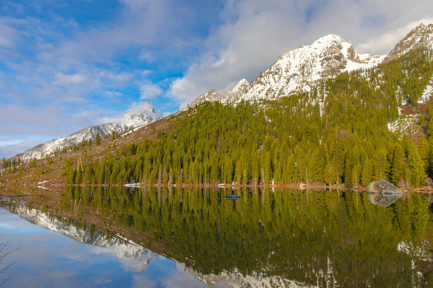 Snow Dusting on String Lake An late spring snow dusts the upper elevations of the Grand Tetons above String Lake.