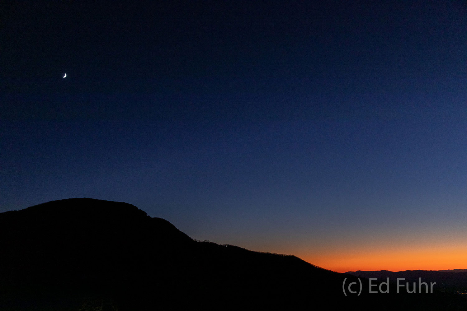 Hawksbill Silhouette Hawksbill Mountain stands silhouetted as the last light of day disappears.