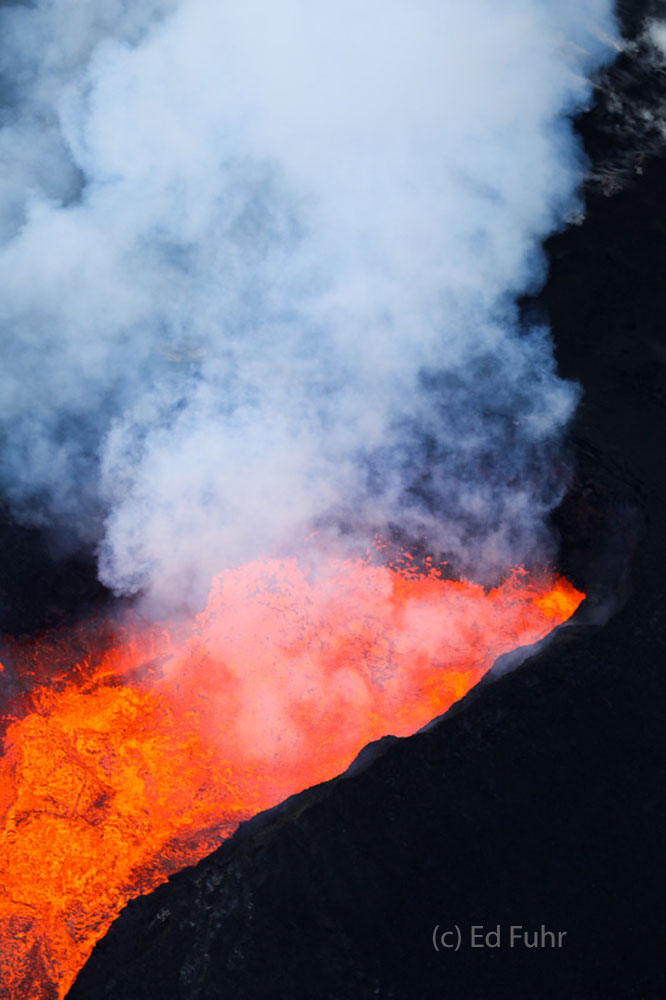 Hundreds of feet above Fissure 8 the heat can be felt from the molten lava pouring  below.