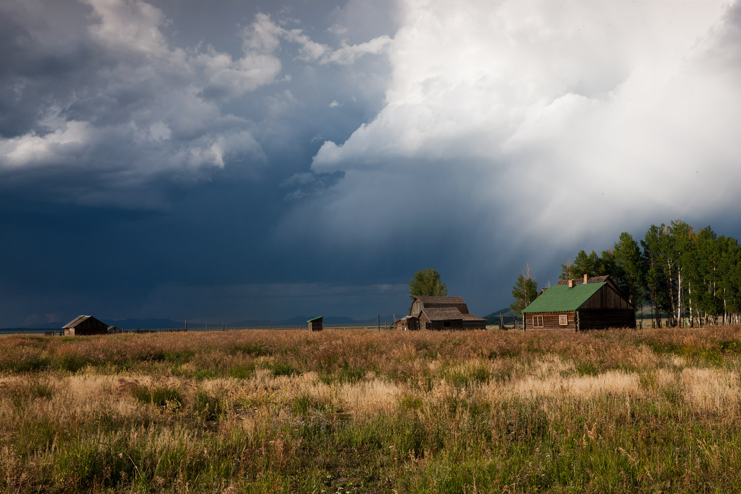 A powerful summer thunderstorm prepares to strike the century old farming homestead on Mormon Row.