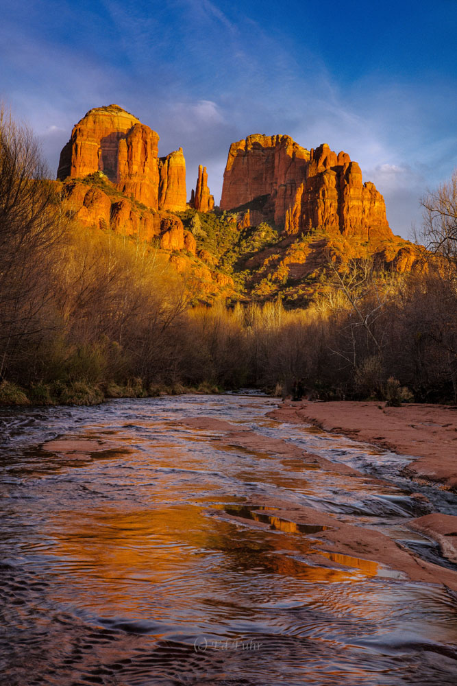 Towering Cathedral Rock reflects in the waters of Oak Creek.