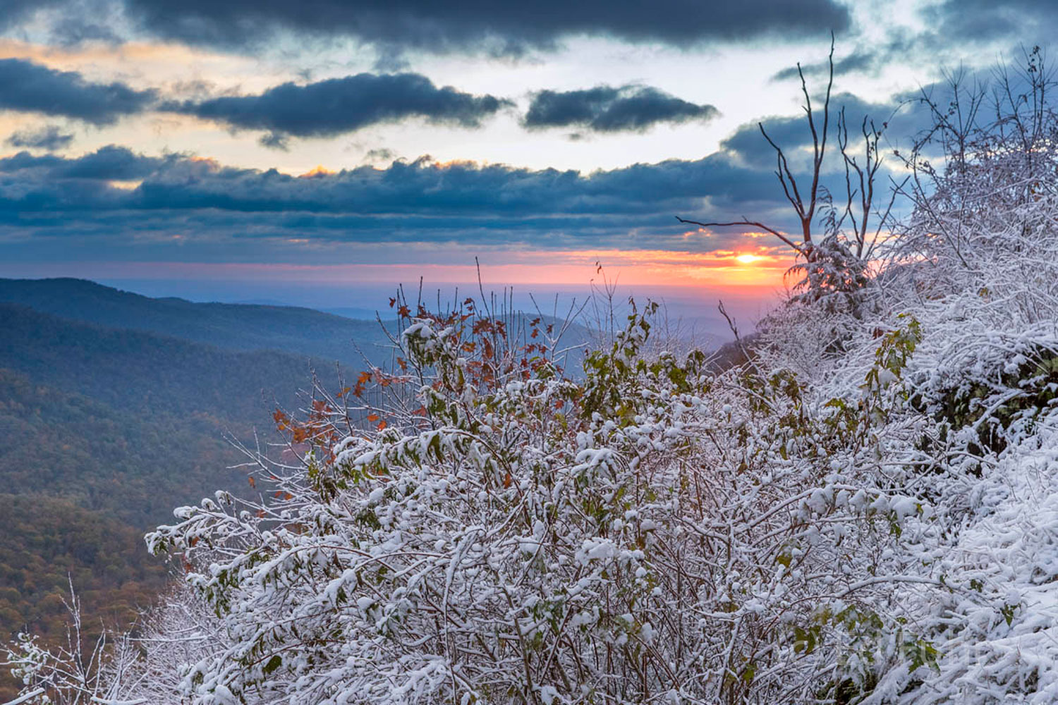 The sun rises after an evening snow has fallen on the higher elevations of Shenandoah National Park.