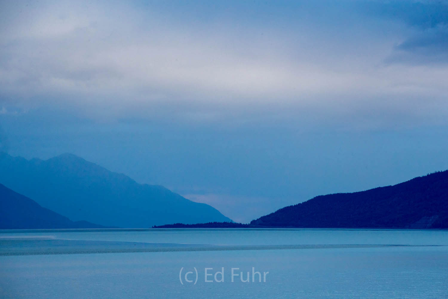 Turnagain Arm is filled with water at dusk.  By early morning the waters will have retreated with the outgoing tide.