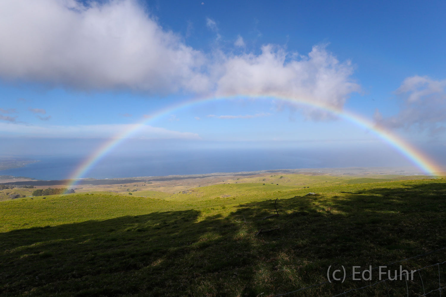 A classic Hawaiian symbol, the rainbow, stretches across the beautiful ranches of Kohala.