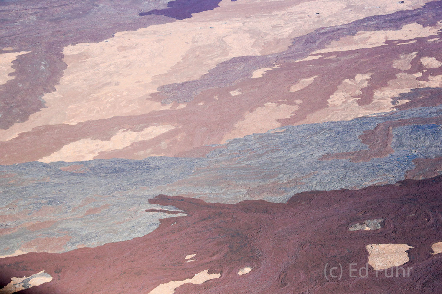 Age old laval flows from prior eruptions are painted in so many pastels.
