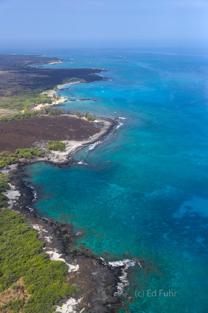 The Big Island shores varies dramatically, from the lush north, to the white, black and even green beaches, to lava fields and...