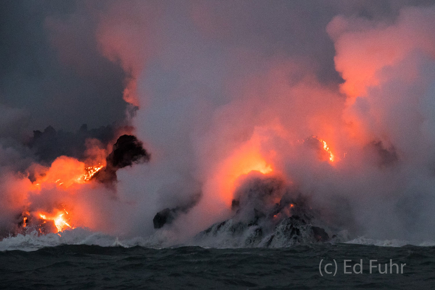 The heat from the 7000 degree lava can be felt hundreds of yards away and it boils the waters of the sea.