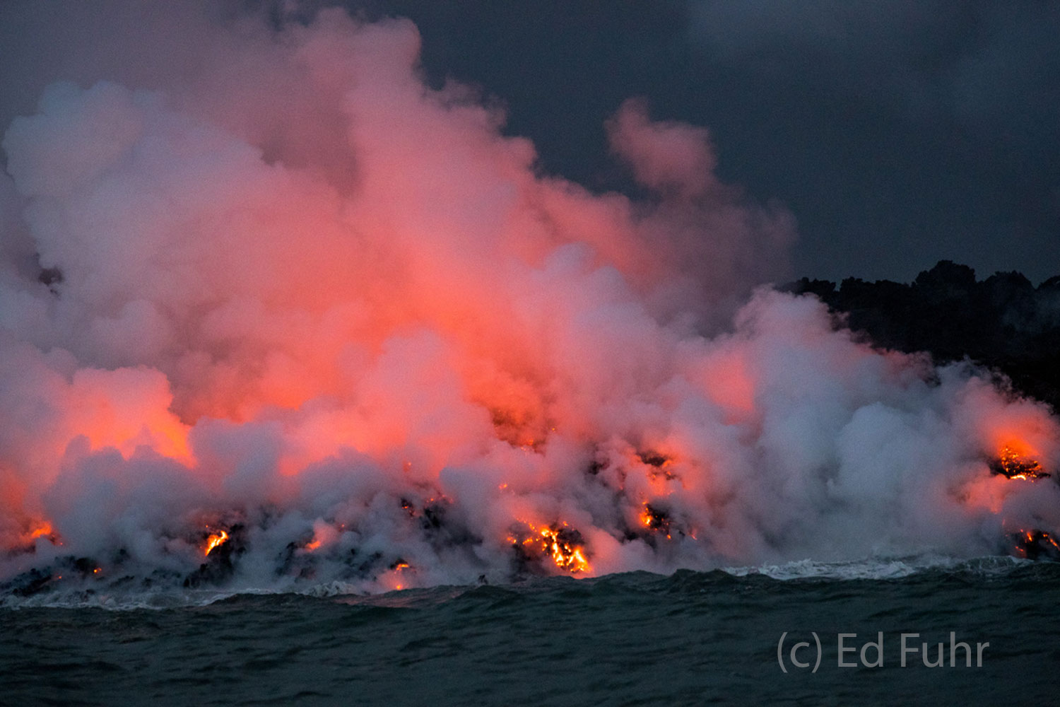 There was something eery about the soft gentle cloud of steam that hovered above the shore and the brilliant coral red that betrayed...