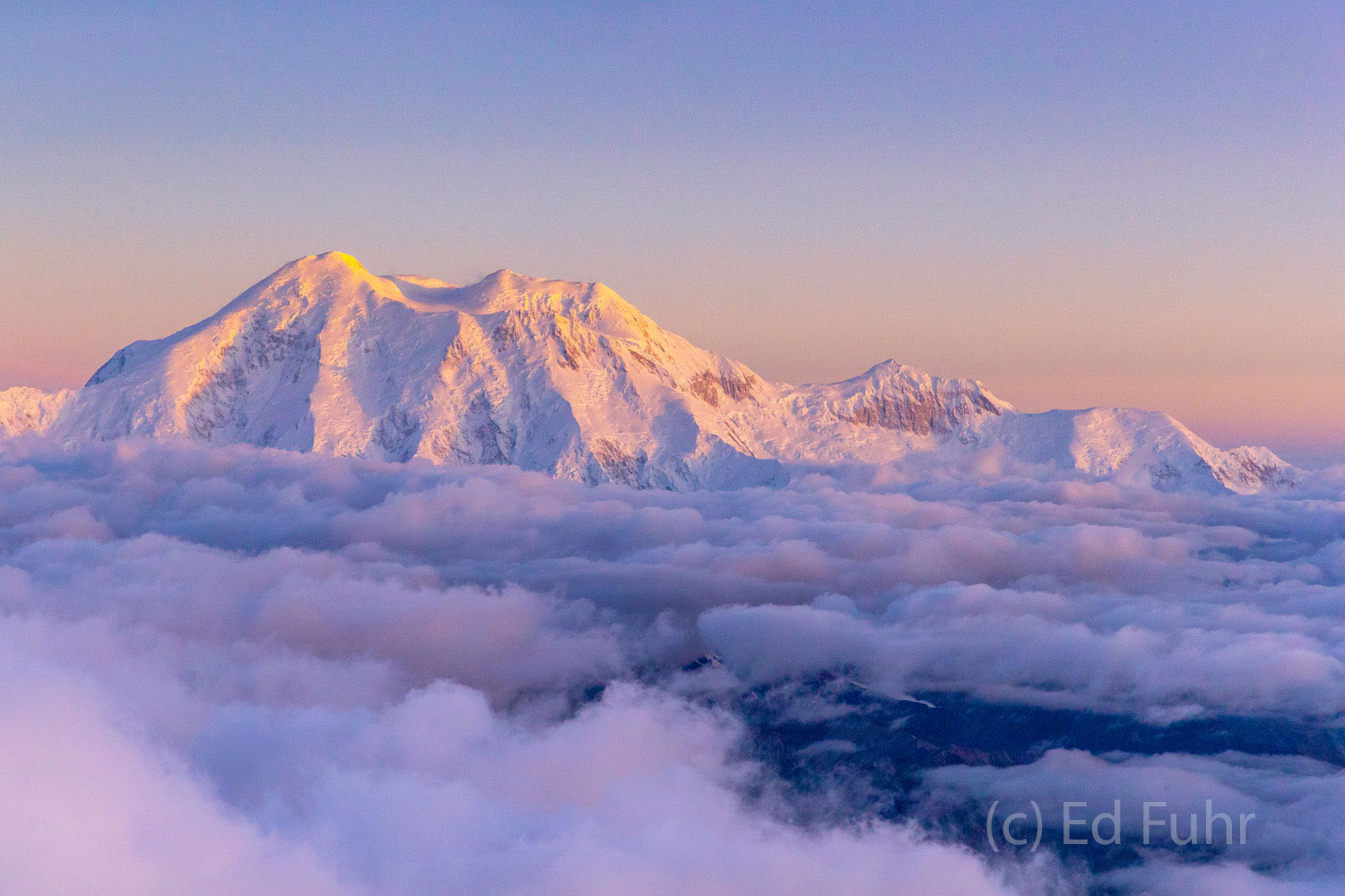 As the golden glow fades, it is replaced briefly by the pink and purple of evening's alpenglow
