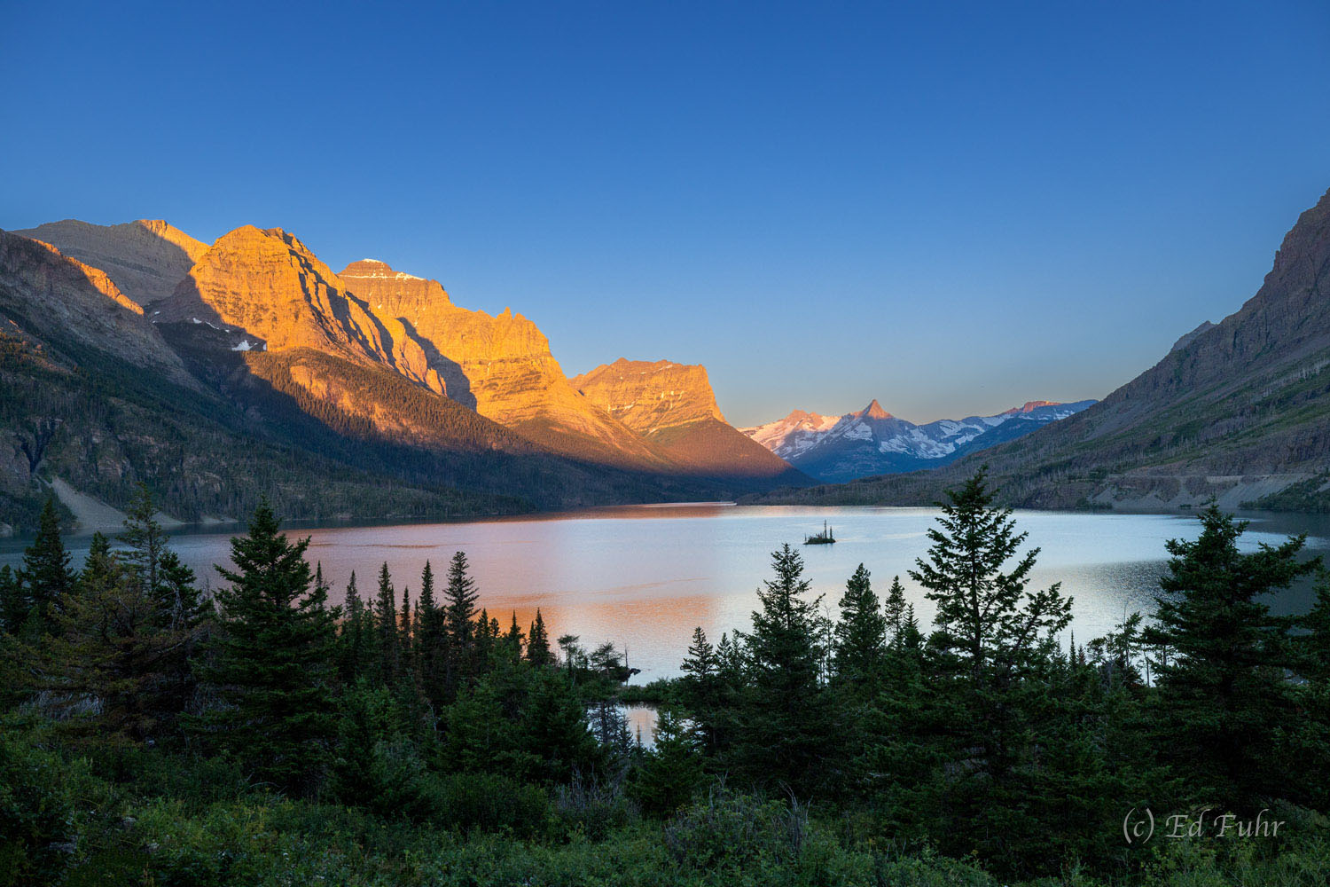 Early summer brings clear skies and a warm sunrise to Wild Goose Island.