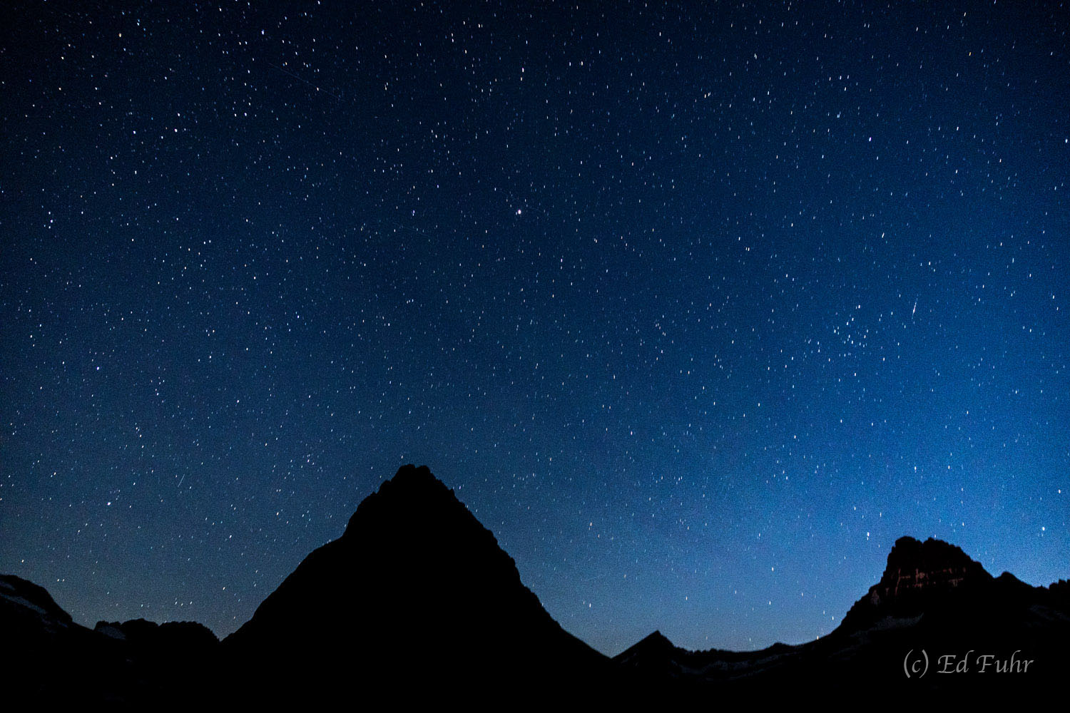 After dusk, an infinite number of stars emerge above the serenity of Many Glacier.