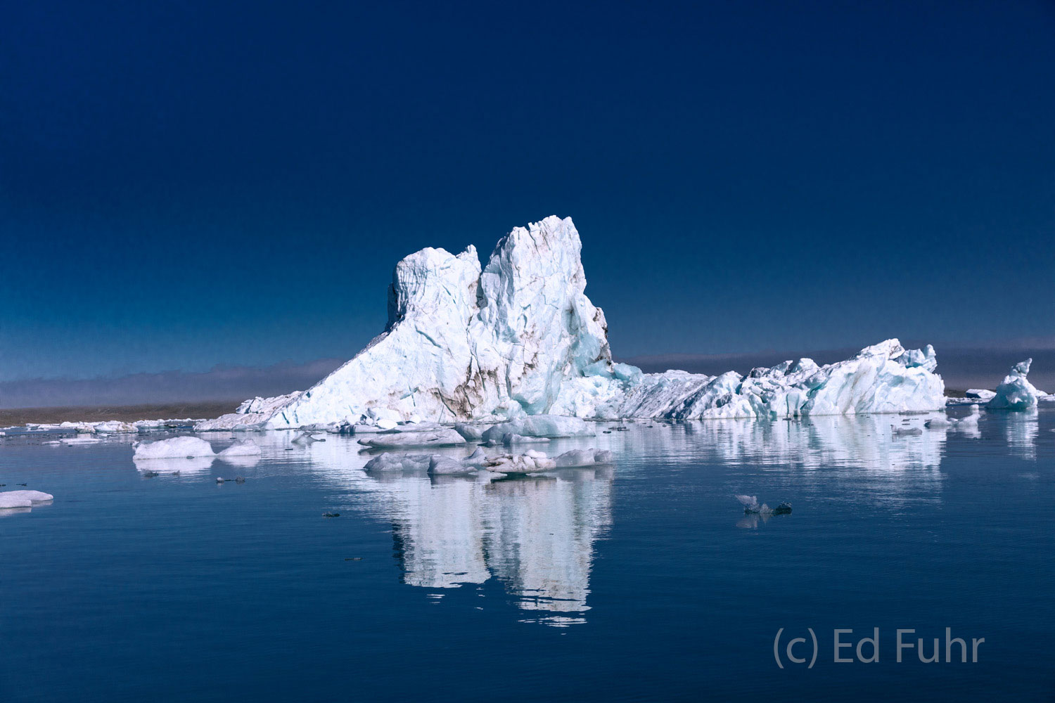 Iceberg Float An large iceberg floats in the late afternoon lagoon below the glacier from which it was calved.