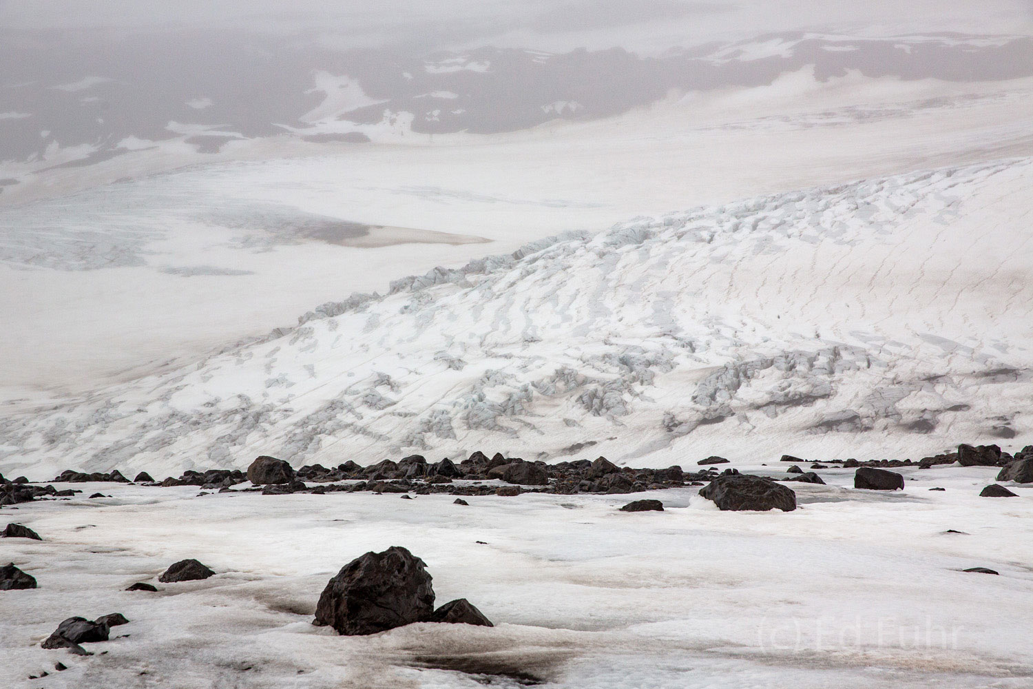 Myrdalsjokull Glacier A snowmobile ride across and up this glacier, in a dense fog and cloud, can leave you disoriented and keenly aware that in an...
