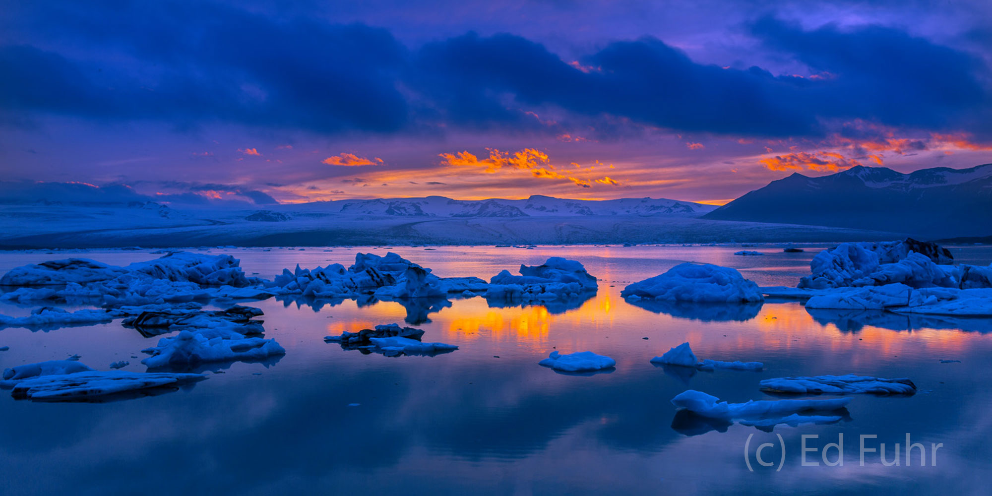 Jokulsarlon Sunset Pano One of the most eerie and moving scenes I have ever witnessed, here lies Jokulsarlon lagoon at sunset. Hundreds of icebergs...
