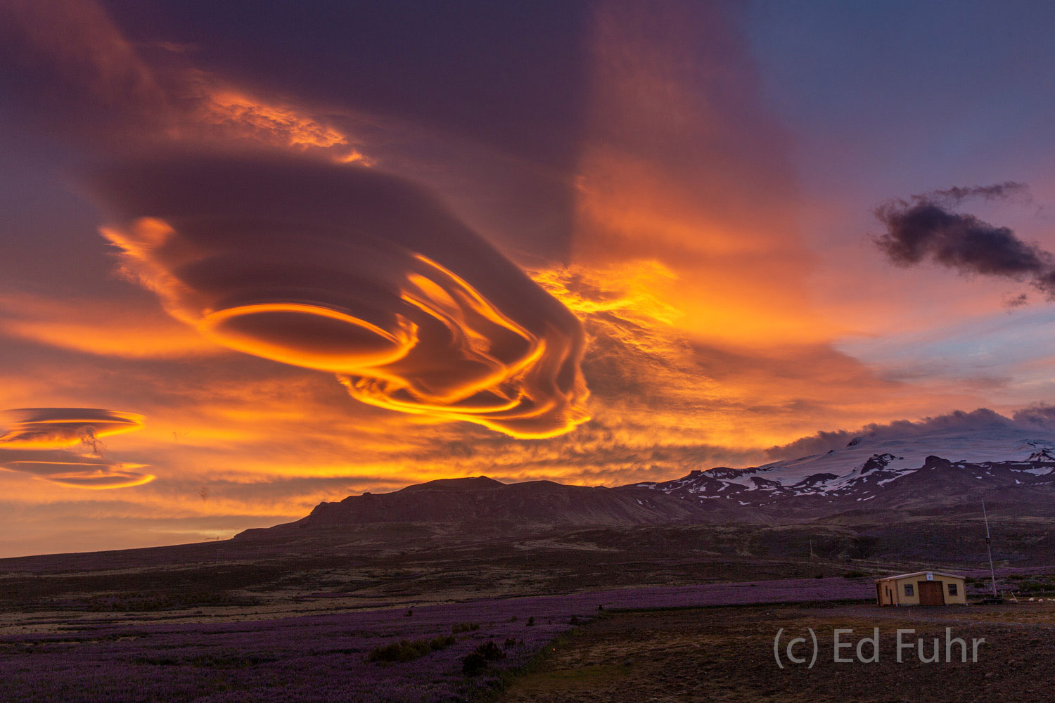 Fire In the Sky Lenticular clouds, made dramatic by the setting sun and sandstorms that have buffeted the island these past days, seem other...