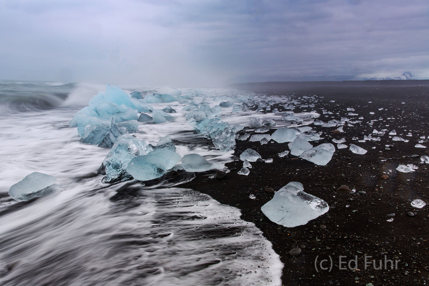 Ice on a Black Beach The never ending fury of the ocean hurls the ice from its midst and to the black sand beaches for a final passing.