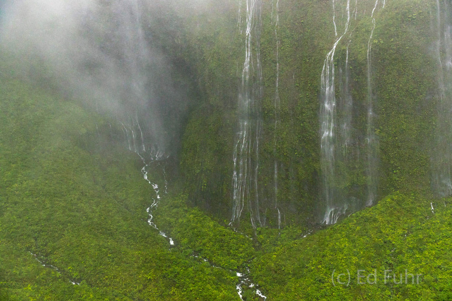 Streams of water tumble down Kauai's rugged mountains.