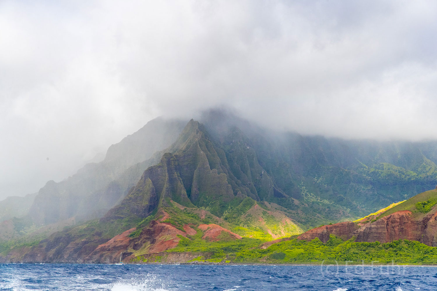 Sailing past Kauai's Na Pali coastline is the only way to appreciate and really see its rich colors, size and splendor.