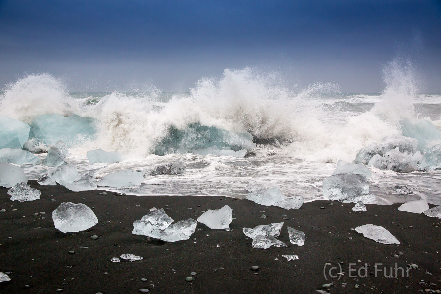 A powerful storm kicks up massive waves that pulverize these once mighty icebergs.