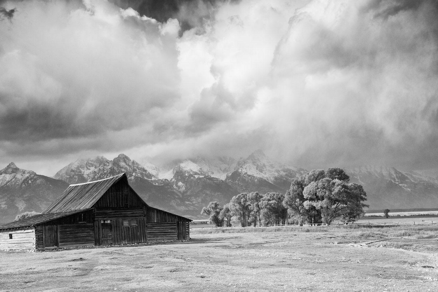 Billowing clouds tumble over the Teton mountains.