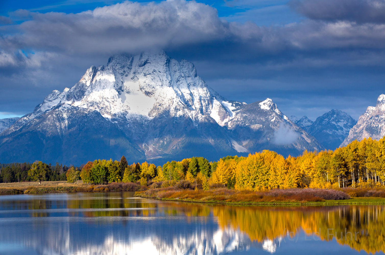 Autumn on the Oxbow after an Early Snow For days the Tetons were cloaked in heavy clouds as the aspen turned golden. At last, the storms cleared one morning, but there...