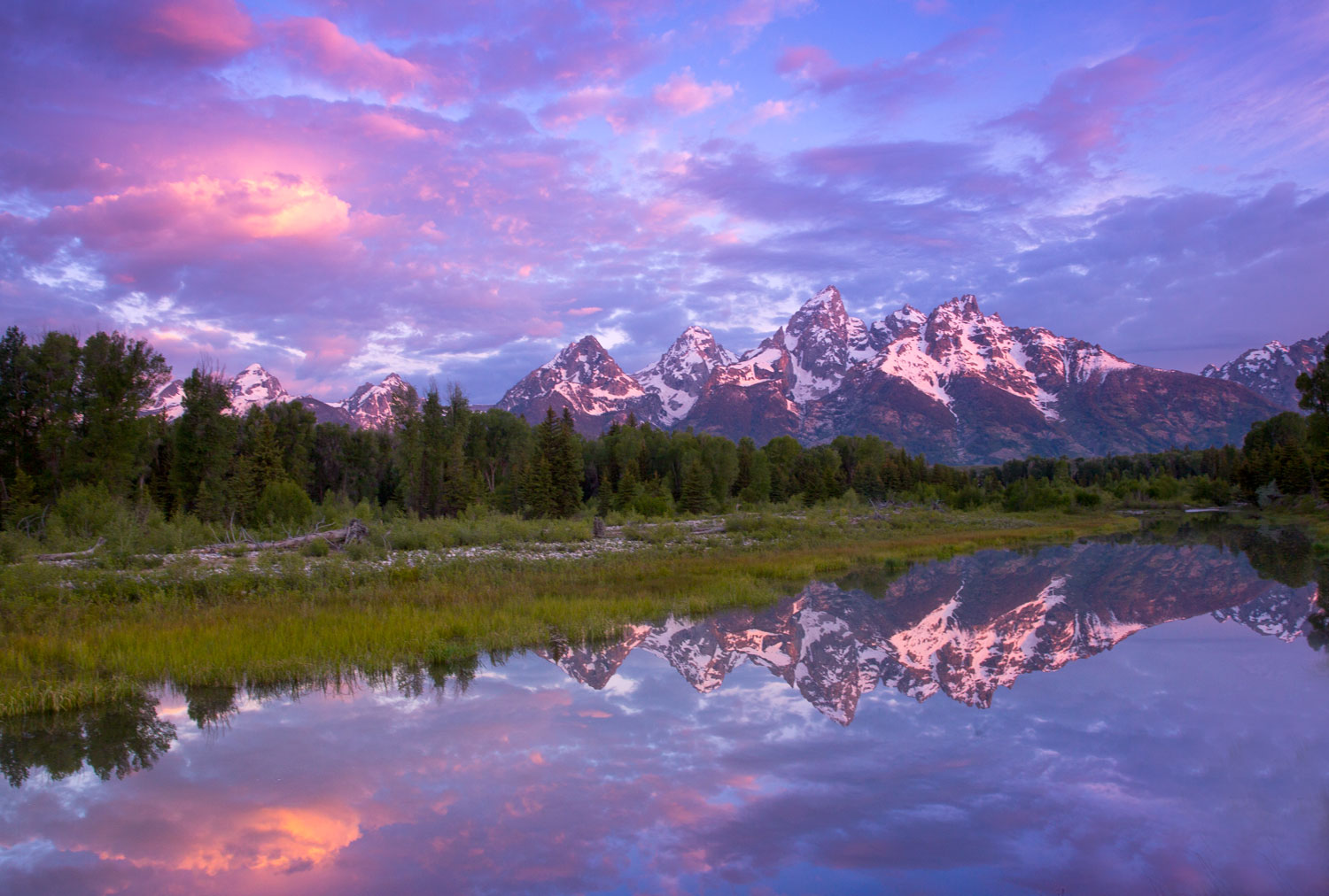 One of my favorite images, Schwabacher's Landing in a beautiful sunrise that paints the sky and reflecting waters all shades...