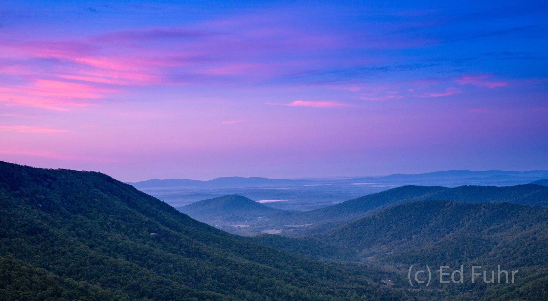 Sunset over the Shenandoah Valley A gentle sunset of purples, pinks and magentas color the evening sky this spring in 2016.