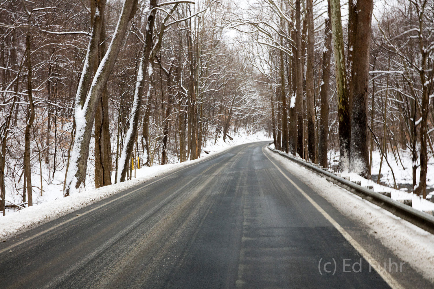 Driving Through the Scars The southern district of Shenandoah tends not to get as much snow as the higher regions further north. Here a light snows contrasts...