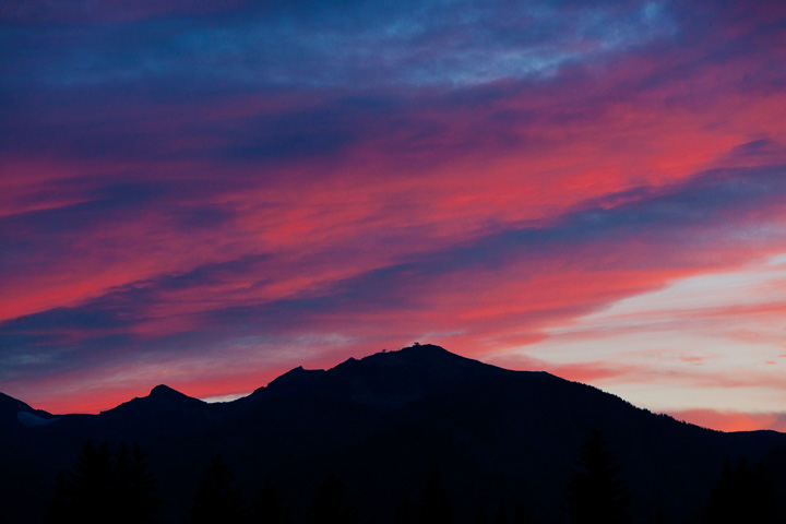 A briliant sunset silhouettes the Tetons and the sublette ski lift.&nbsp;