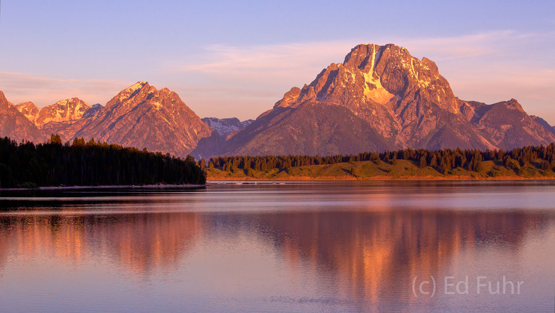 A golden sunrise on Oxbow Bend of the Snake River.