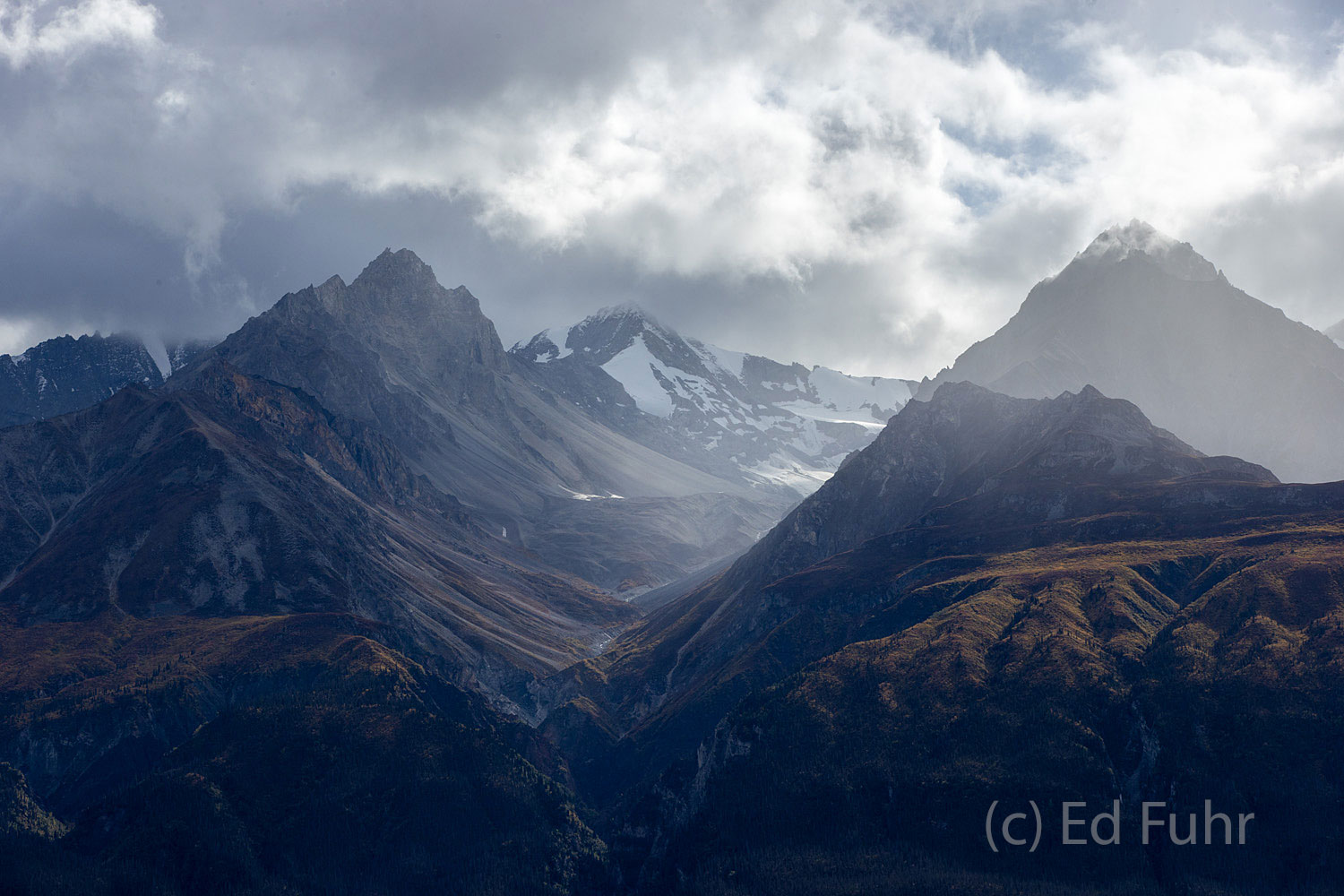 Across the Chitina River Baldy Mountain and the Chugach Mountain range rise high above us on the Chitina River.