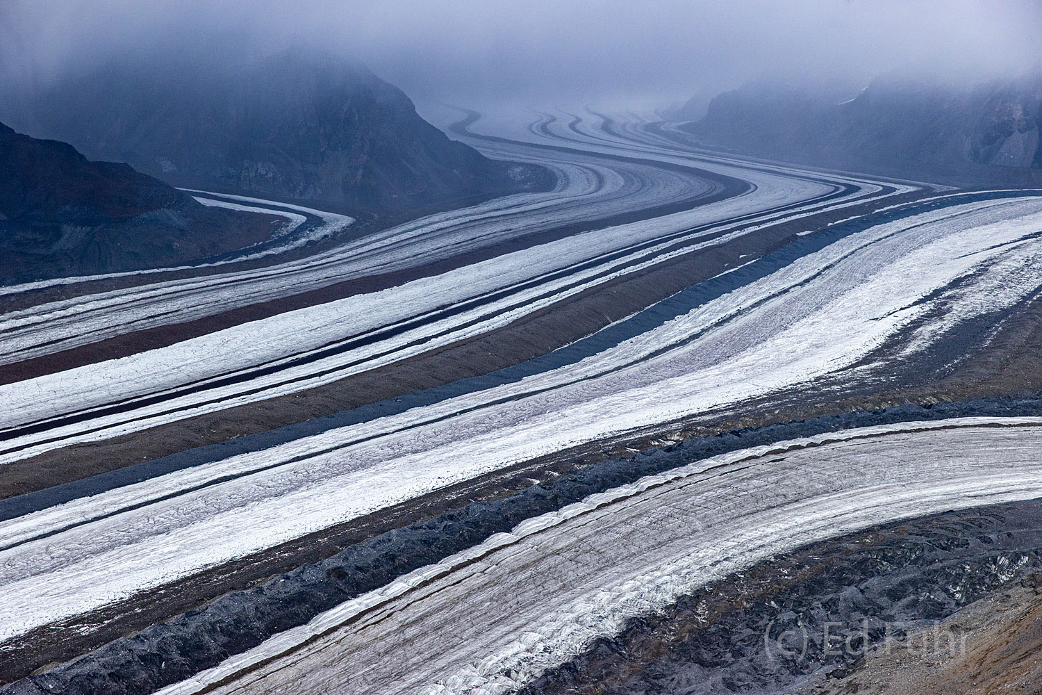 The miles long track of Barnard Glacier flowing to the Chitina River.