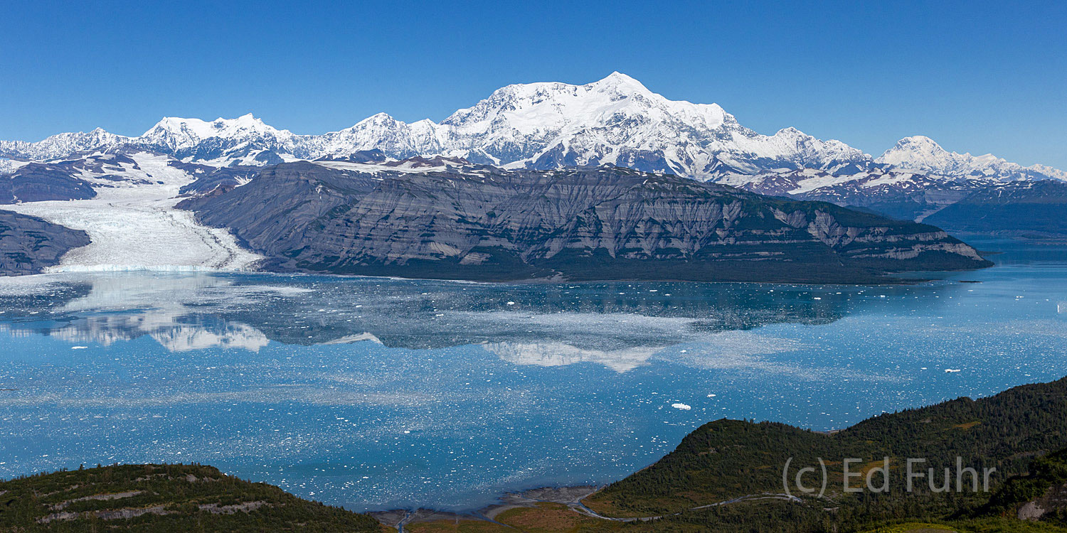 St. Elias dominates above Icy Bay as even larger Mount Logan, located in Canada, rises to the right.