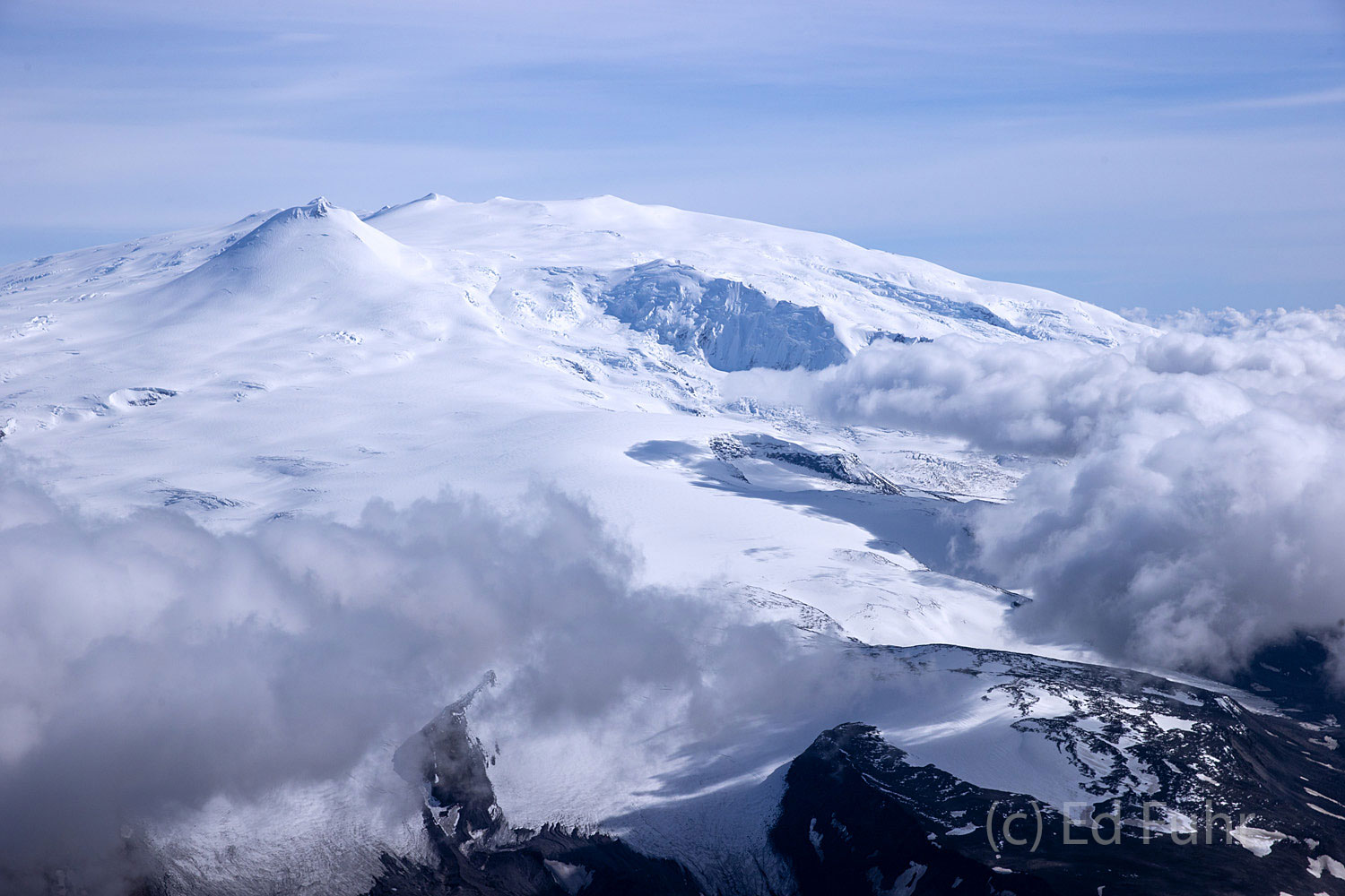 Mount Wrangell, a massive shield volcano, is the only volcano that remains at least somewhat active, rising 14,163 feet in an...