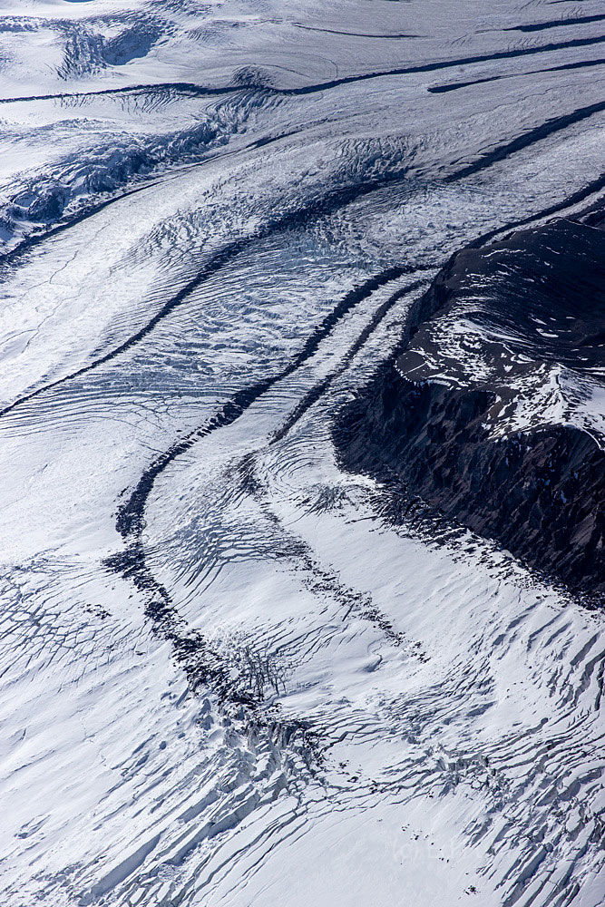 Colossal glacial tracks converge and run through and across the landscape.