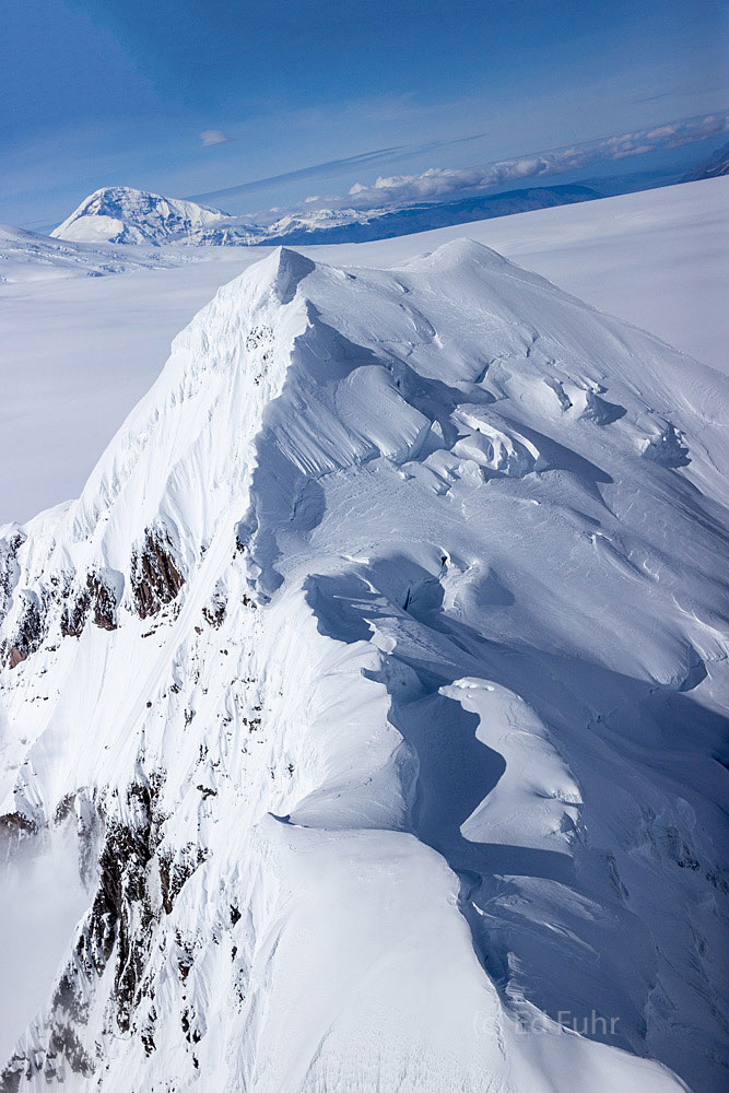 Aerial view of Mount Sanford in distance.