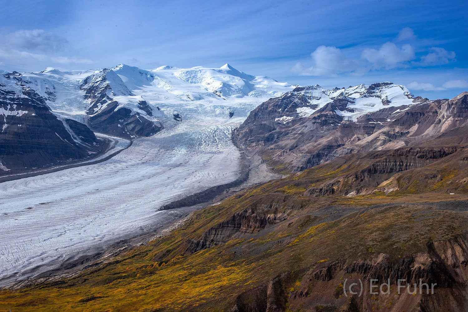Mount Blackburn and Root Glacier Surrounded by fall's colors, Root Glacier sweeps down from massive Mount Blackburn.